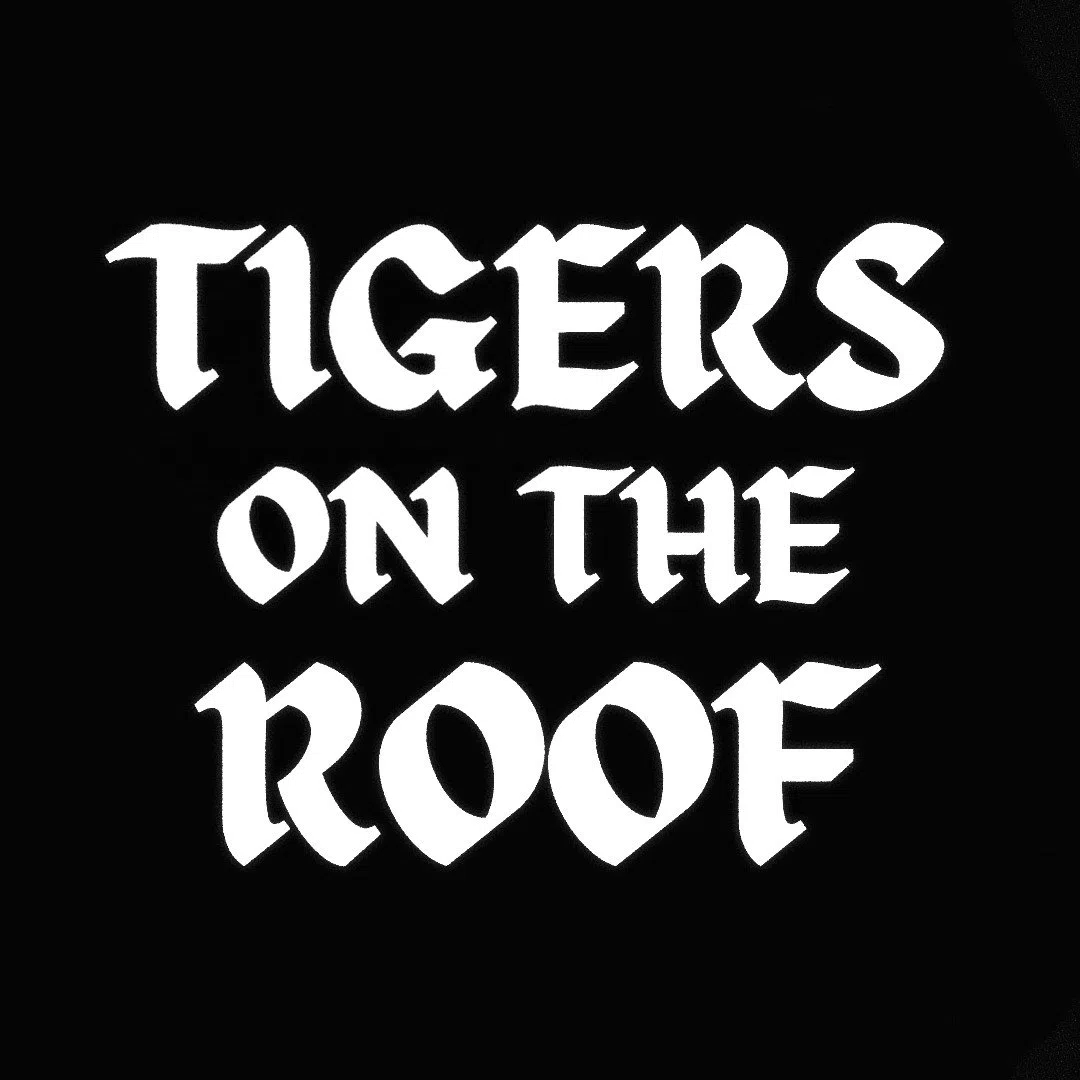 Tigers on the Roof